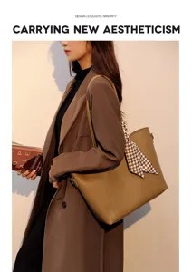 Detailed shot of stylish brown leather tote bag with chic checkered scarf, worn by model.