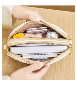 Quilted crossbody bag interior detail showing spacious multi-layer storage capacity.