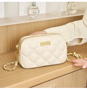 Chic quilted small square crossbody bag with gold chain and plaque, elegant casual shoulder bag.
