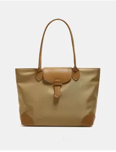 Detailed view of the vintage oxford cloth tote bag showing leather flap and reinforced corners.