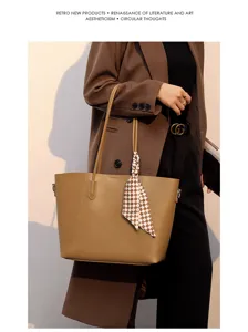 Stylish large capacity PU leather tote bag with elegant plaid scarf charm for women daily wear.