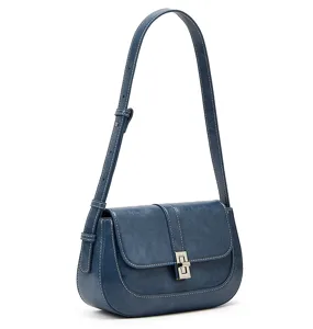 Blue retro saddle bag, elegant crossbody shoulder bag with metal lock and contrast stitching.
