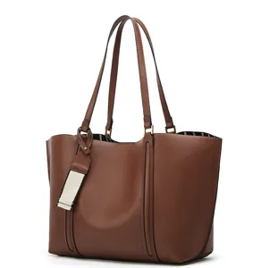 Brown PU leather tote bag detail showcasing dual shoulder straps, vertical seams and lining.