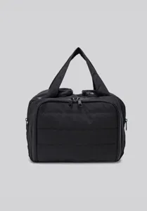 Detailed view of the black quilted travel makeup bag, featuring durable fabric and smooth dual zippers.
