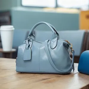 Stylish light blue Boston handbag detail view, large capacity casual PU leather cross body bag.