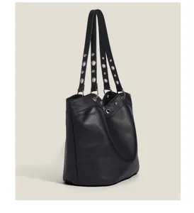 Black leather bucket bag with metal grommet straps, stylish shoulder bag for daily wear.