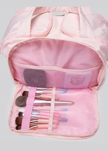 Pink portable makeup bag with brush holder and mesh pockets for travel and daily cosmetic storage.