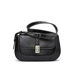 Black vintage saddle bag for women, chic leather shoulder crossbody bag with metal lock.