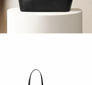 Vista detallada del bolso tote de cuero negro, diseño minimalista para uso diario.