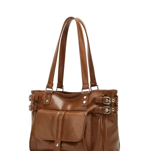 Detailed view of the brown leather shoulder bag with side buckles and front pocket design.