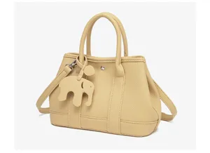 Detailed view of the stylish yellow leather tote bag showcasing fine texture and handles.