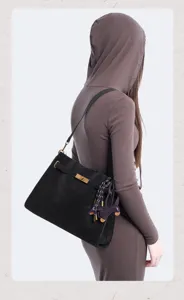 Women black suede shoulder bag vintage retro tote handbag with stylish lock buckle and cute charm.