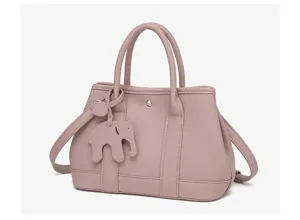 Pink leather tote bag with cute elephant charm, top handles and crossbody strap detail.