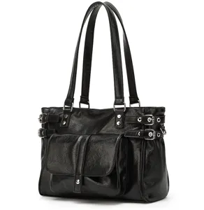 Black faux leather tote bag detail showing side buckled straps and front pocket design.