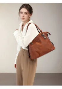 Detail view of vintage brown women tote bag, ideal for daily commute and large capacity storage.