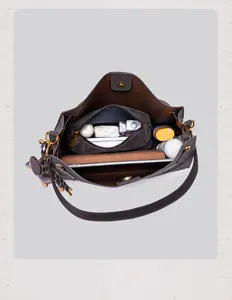Detailed top view of the vintage brown suede handbag interior capacity and multiple compartments.