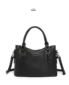 Black PU leather handbag detail showing metal double buckle and adjustable shoulder strap.