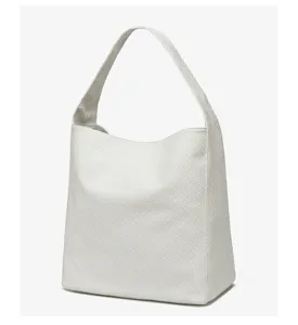 Korean style woven underarm bag detail view, chic white handbag for daily commute use.