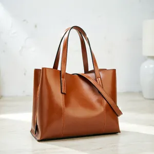 Close-up view of the brown oil-wax leather women tote bag showing fine texture and strap detail.
