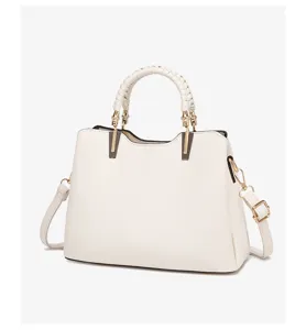 Classic white commuter handbag with braided top handle and spacious interior for daily use.