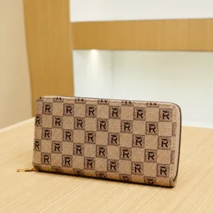 Fashionable women's long wallet with chic monogram print, zip-around design, elegant daily clutch.