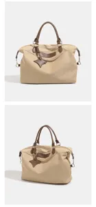 Canvas travel duffel bag detail showing spacious interior design and durable brown leather handles.