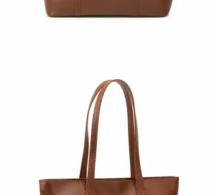Detalle de bolso tote de cuero marrón con estilo urbano minimalista y finas costuras.