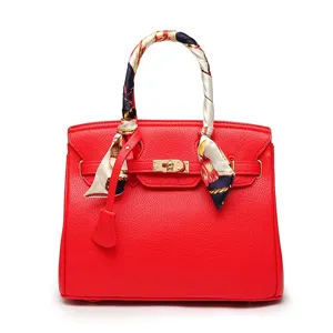 Red litchi grain women handbag, elegant lock shoulder messenger bag with silk scarf handle.