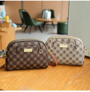 Stylish monogram shell crossbody bag for women, large capacity daily shoulder bag.
