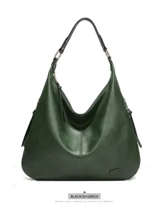 Dark green hobo shoulder bag detail, vintage PU leather fashion handbag with zipper and rings.