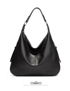Detailed view of black leather hobo shoulder bag texture, hardware ring and casual design.