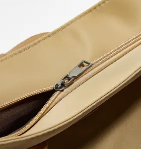 Oxford cloth handbag zipper detail, durable material and smooth metallic zipper view.