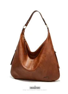 Detailed view of the brown retro hobo shoulder bag, showcasing premium leather texture and hardware.