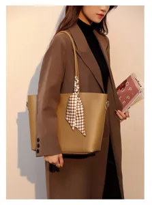 Detail view of the elegant minimalist tote bag featuring a chic checkered scarf accessory.