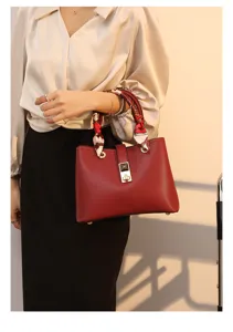 Red PU leather tote bag with scarf detail and metal lock closure, elegant shoulder handbag.