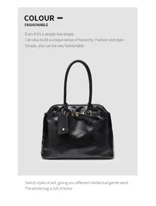 Classic black vintage top handle shoulder bag with metal buckle detail for daily wear.