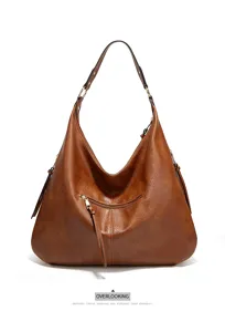 Vintage brown shoulder bag for women, large capacity hobo handbag with tassel detail.