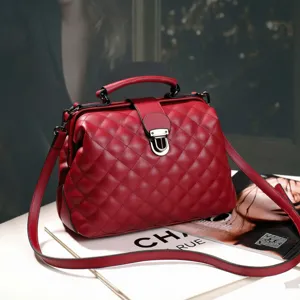 Red quilted boston handbag for women, chic top handle shoulder crossbody bag with secure metal lock.