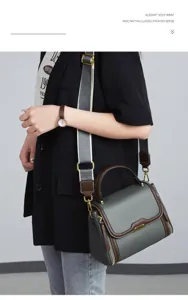 Stylish women's shoulder crossbody bag with wide strap, trendy grey leather handbag.