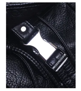 Close-up view of black soft leather backpack hardware showing metal buckle and fine stitching.