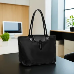 Detailed view of black oxford cloth tote bag, casual commuter handbag with double handles.