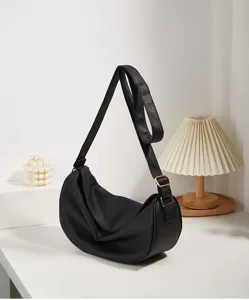 Stylish black leather hobo shoulder bag, minimalist casual crossbody dumpling bag for women.