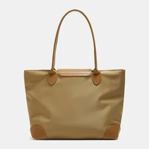 Casual nylon tote bag for women, large capacity travel handbag with brown leather handles.