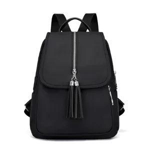 Stylish black oxford cloth backpack featuring vertical front zipper and cute tassels.