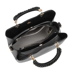 Classic minimalist black tote bag with stylish braided handle and spacious interior.