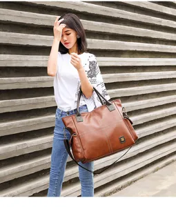 Large capacity brown leather tote bag detail view, vintage commuter shoulder and crossbody bag.