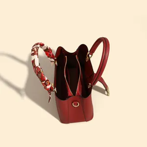 Elegant red leather tote bag for women, spacious structured top handle handbag with printed scarf.