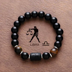 Libra zodiac beaded bracelet detail view featuring natural black obsidian and tiger eye stones.