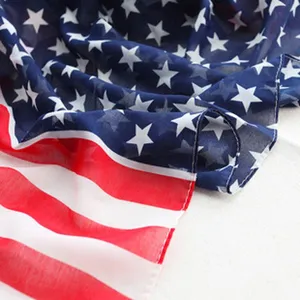 American flag chiffon scarf detail, lightweight and stylish draped fabric with stars and stripes.