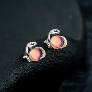 Exquisite snake shaped clip on earrings with iridescent crystal balls, stylish and unique design.